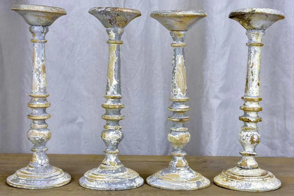 Collection of four rustic vintage candlesticks