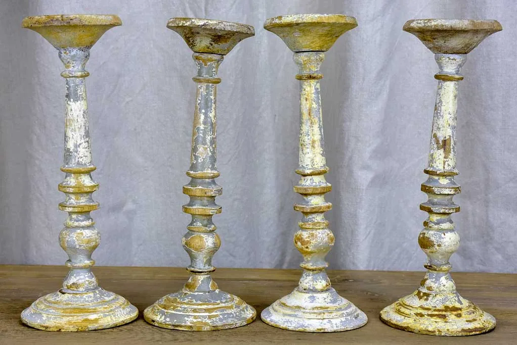 Collection of four rustic vintage candlesticks