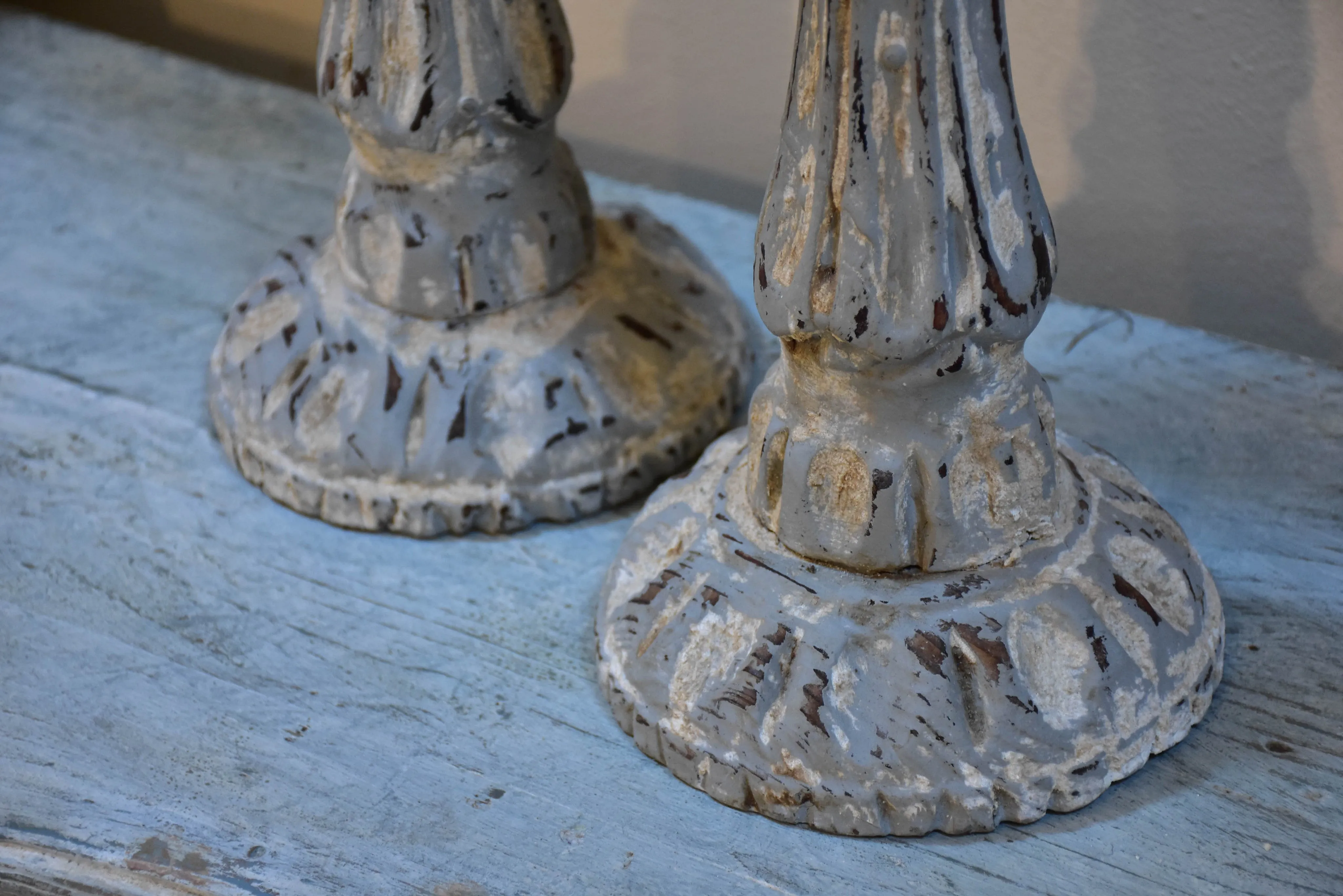 Pair of French candlesticks with white patina