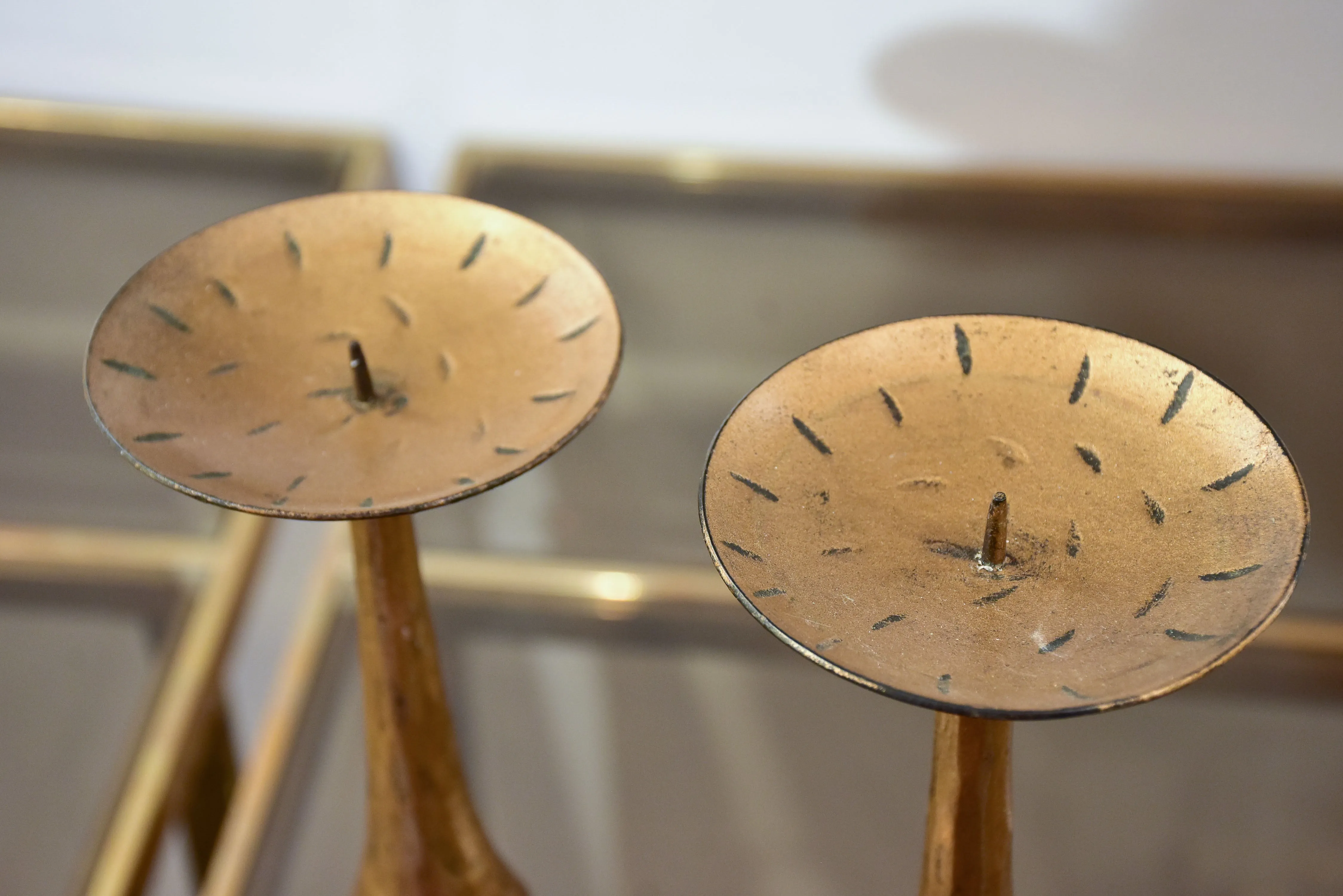 Pair of vintage gold candlesticks with a tripod stand