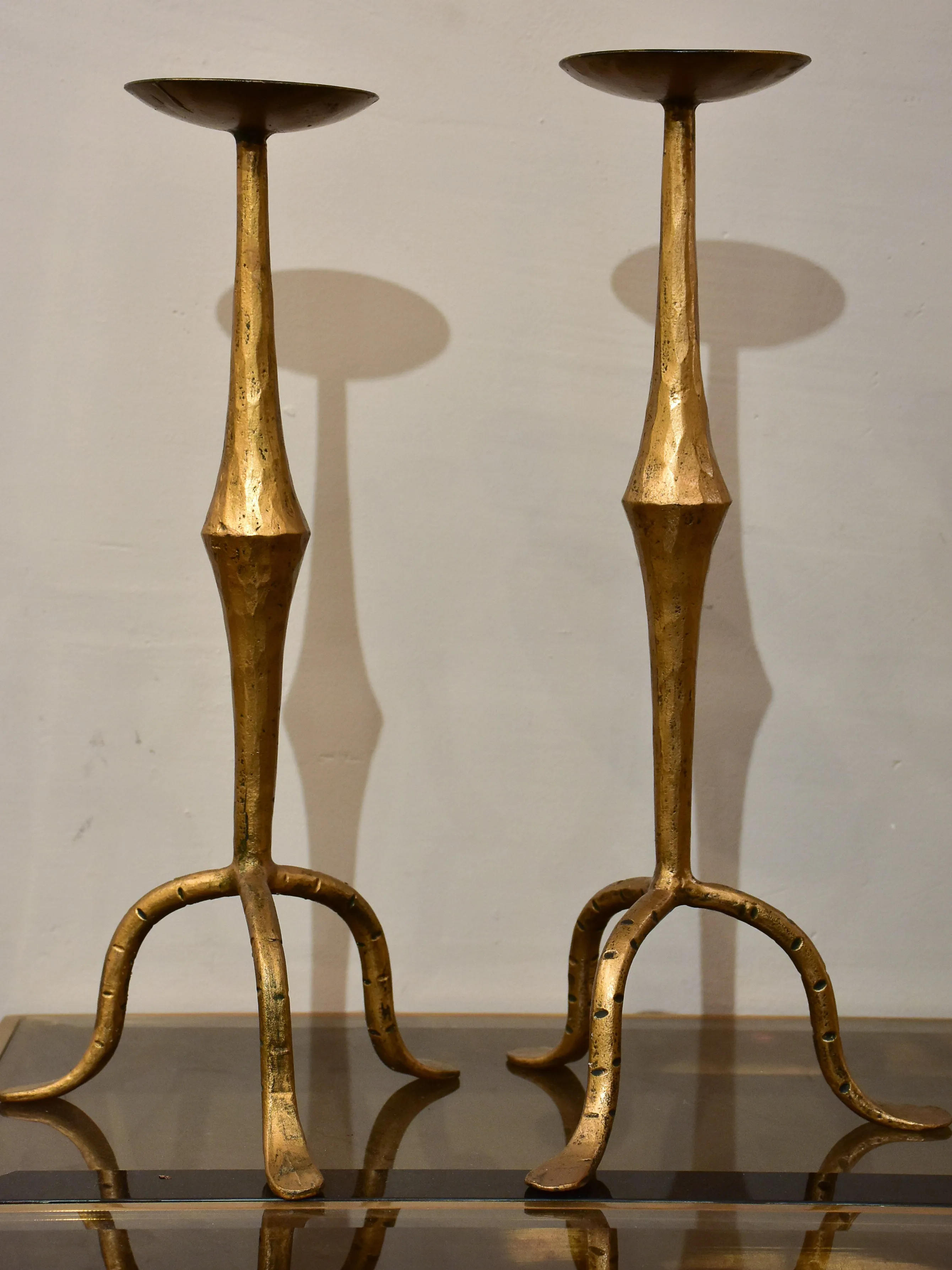 Pair of vintage gold candlesticks with a tripod stand