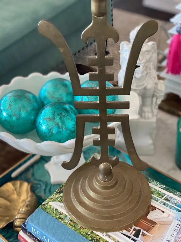 Vintage Brass candle holder with an Asian motif