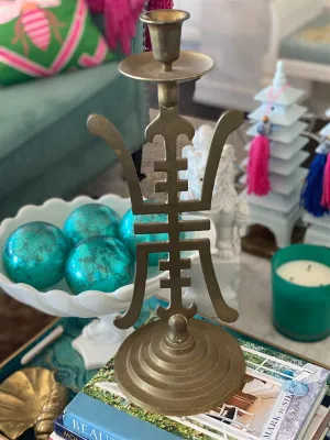 Vintage Brass candle holder with an Asian motif